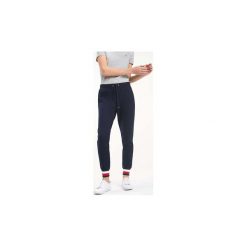 Spodnie treningowe Tommy Hilfiger WW0WW2497 HERITAGE. Niebieskie spodnie damskie TOMMY HILFIGER, s. Za 322,50 zł.