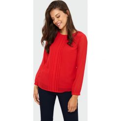 Elegancka bluzka z plisami. Bluzki damskie Greenpoint, bez wzorów, z poliesteru, eleganckie, bez kołnierzyka, bez rękawów. Za 69,99 zł.