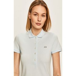 Lacoste - Top. Niebieskie bluzki damskie Lacoste, bez wzorów, z elastanu, casualowe, bez kołnierzyka. W wyprzedaży za 269,90 zł.