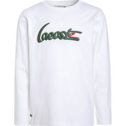 Lacoste Bluzka z długim rękawem white. Białe bluzki dziewczęce Lacoste, z bawełny, z długim rękawem. W wyprzedaży za 127,20 zł.