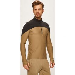Under Armour - Bluza. Zielone bluzy męskie Under Armour, s, bez wzorów, z elastanu, z kapturem, z krótkim rękawem, krótkie, bez kaptura. W wyprzedaży za 199,90 zł.