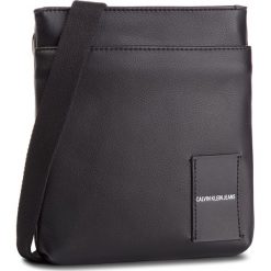 Saszetka CALVIN KLEIN JEANS - Coated Canvas Micro Flat Pack K40K40814 001. Czarne torby męskie skórzane Calvin Klein Jeans, bez wzorów, z jeansu, młodzieżowe. W wyprzedaży za 239,00 zł.