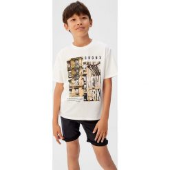 Mango Kids - Szorty dziecięce Jimmy 110-164 cm. Szare spodenki chłopięce Mango Kids, z aplikacjami, z elastanu, casualowe. W wyprzedaży za 49,90 zł.