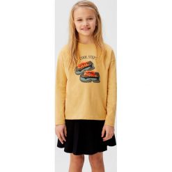 Mango Kids - Longsleeve dziecięcy Steps 110-164 cm. Żółte bluzki dziewczęce Mango Kids, z aplikacjami, z bawełny, z okrągłym kołnierzem, z krótkim rękawem, krótkie, bez kaptura. Za 59,90 zł.