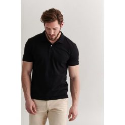 Koszulka polo w kolorze czarnym. Czarne koszulki męskie TATUUM, xxl, bez wzorów, z bawełny, bez rękawów. W wyprzedaży za 64,95 zł.