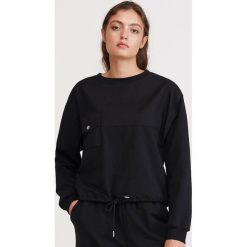 Bluza z kieszonką - Czarny. Czarne bluzy damskie Reserved, s, bez wzorów, bez rękawów, bez kaptura. Za 89,99 zł.