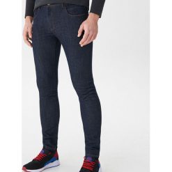 Jeansy slim fit - Niebieski. Niebieskie jeansy damskie relaxed fit marki House. Za 99,99 zł.