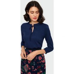 Elegancka bluzka. Bluzki damskie Greenpoint, bez wzorów, z elastanu, eleganckie, bez kołnierzyka, bez rękawów. Za 99,99 zł.