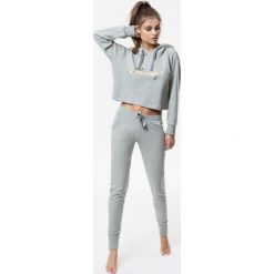 Cardio Bunny - Spodnie Pretty. Szare spodnie sportowe damskie marki DOMYOS, z bawełny. Za 199,90 zł.