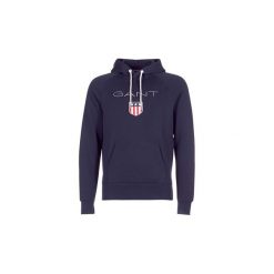 Bluzy Gant GANT SHIELD SWEAT HOODIE. Niebieskie bluzy męskie GANT, s, bez wzorów, bez kołnierzyka, bez rękawów, bez kaptura. Za 429,00 zł.