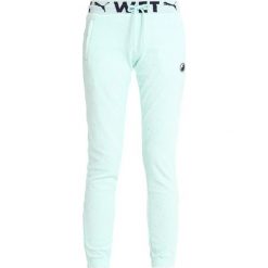 Fenty PUMA by Rihanna FITTED TRACK PANT Spodnie treningowe bay. Zielone spodnie damskie marki Fenty PUMA by Rihanna, l, z bawełny. Za 719,00 zł.
