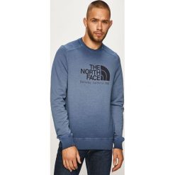 The North Face - Bluza. Niebieskie bluzy męskie The North Face, s, z nadrukiem, z bawełny, z okrągłym kołnierzem, bez rękawów, bez kaptura. W wyprzedaży za 219,90 zł.