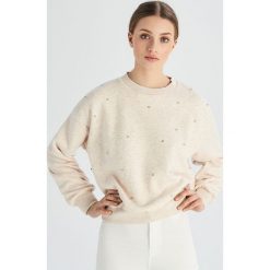 Bluza z aplikacją z kryształków - Beżowy. Brązowe bluzy damskie Sinsay, s, z aplikacjami, bez rękawów, bez kaptura. W wyprzedaży za 19,99 zł.
