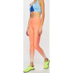 Reebok - Legginsy. Pomarańczowe spodnie damskie Reebok, s, z elastanu. W wyprzedaży za 149,90 zł.