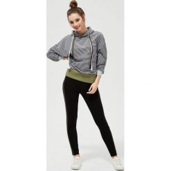Legginsy z lampasem. Czarne spodnie damskie Moodo, m, z elastanu. Za 79,99 zł.