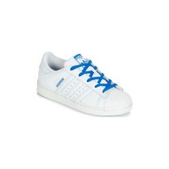 Buty Dziecko adidas SUPERSTAR C. Białe trampki dziewczęce Adidas, bez wzorów, bez zapięcia. Za 201,80 zł.