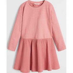 Mango Kids - Sukienka dziecięca Adri 110-164 cm. Różowe sukienki dziewczęce Mango Kids, bez wzorów, z bawełny, casualowe, z długim rękawem, długie, maxi, rozkloszowane. Za 79,90 zł.