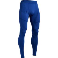 Legginsy termoaktywne Keepdry 500 niebieskie. Niebieskie getry męskie termoaktywne KIPSTA, s, bez wzorów, z elastanu, do piłki nożnej. Za 59,99 zł.