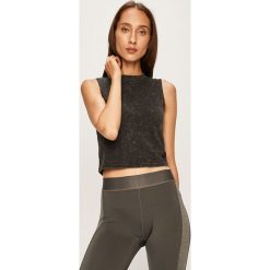 Reebok - Top. Czarne topy damskie Reebok, xs, bez wzorów, z bawełny, z okrągłym kołnierzem. W wyprzedaży za 99,90 zł.