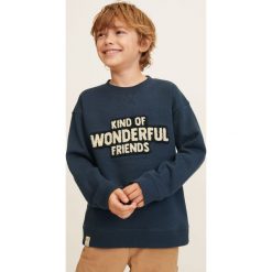Mango Kids - Bluza dziecięca 104-164 cm. Niebieskie bluzy chłopięce marki Mango Kids, bez wzorów, z bawełny, bez rękawów, bez kaptura. Za 59,90 zł.