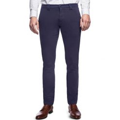 Spodnie STEFANO SMGS030058. Niebieskie spodnie męskie Giacomo Conti, na co dzień, s, bez wzorów, z elastanu, klasyczne. Za 259,00 zł.