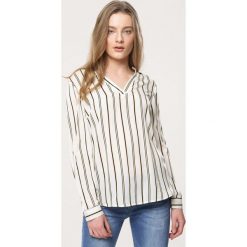 Biała Koszula Clash. Białe bluzki damskie Born2be, xl, bez wzorów, bez kołnierzyka, z długim rękawem. Za 49,99 zł.