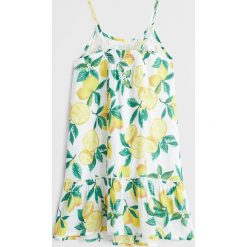 Mango Kids - Sukienka dziecięca Lemon 110-164 cm. Białe sukienki dziewczęce Mango Kids, bez wzorów, z bawełny, bez rękawów, mini, rozkloszowane. Za 119,90 zł.