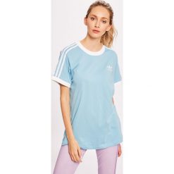 Adidas Originals - Top. Niebieskie topy damskie adidas Originals, bez wzorów, z elastanu, z okrągłym kołnierzem. W wyprzedaży za 99,90 zł.