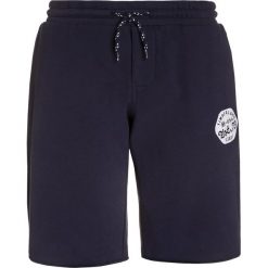 Timberland Spodnie treningowe blue indigo. Czerwone spodnie chłopięce marki Timberland, z materiału. Za 159,00 zł.