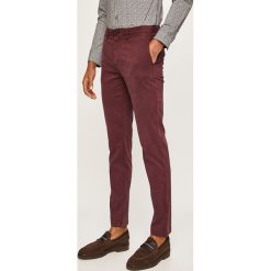 Tommy Hilfiger - Spodnie. Zielone spodnie męskie TOMMY HILFIGER, na co dzień, bez wzorów, z elastanu, casualowe. Za 449,90 zł.
