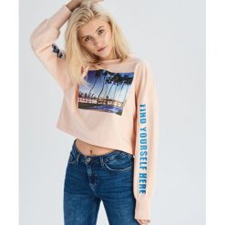 Bluza z fotograficznym nadrukiem - Różowy. Różowe bluzy damskie marki Sinsay, s, z nadrukiem, bez rękawów, bez kaptura. Za 49,99 zł.