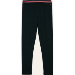 Tommy Hilfiger - Legginsy dziecięce 128-164 cm. Niebieskie spodnie dziewczęce TOMMY HILFIGER, bez wzorów, z elastanu. Za 119,90 zł.