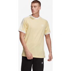 Adidas Originals Koszulka Żółty. Żółte podkoszulki męskie adidas Originals, s, bez wzorów, z bawełny, z krótkim rękawem. Za 128,95 zł.