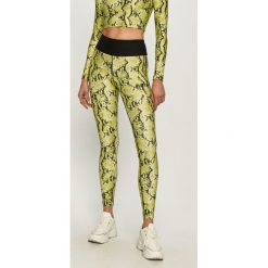 Guess Jeans - Legginsy. Żółte spodnie damskie Guess Jeans, s, z elastanu, z podwyższonym stanem. Za 229,90 zł.