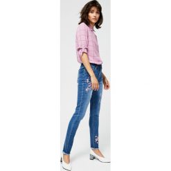 Jeansy typu skinny z haftem. Niebieskie jeansy damskie Moodo, xl. Za 69,99 zł.