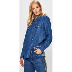 Calvin Klein Jeans - Koszula. Niebieskie bluzki damskie Calvin Klein Jeans, na co dzień, s, bez wzorów, z bawełny, casualowe, bez kołnierzyka, z długim rękawem. W wyprzedaży za 219,90 zł.