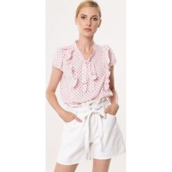 Jasnoróżowa Bluzka Bikini. Różowe bluzki damskie Born2be, xl, bez wzorów, bez kołnierzyka, z krótkim rękawem. Za 49,99 zł.