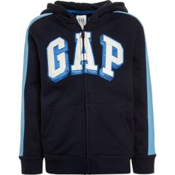 GAP BOYS ACTIVE ARCH HOOD Bluza rozpinana true indigo. Niebieskie bluzy chłopięce marki GAP, z bawełny. Za 129,00 zł.