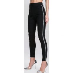 Czarne Legginsy Sympathizing. Czarne legginsy damskie marki other, xl, z aplikacjami, z dzianiny. Za 59,99 zł.