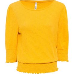 Shirt z przeszyciem cienkimi gumkami w dolnej części bonprix żółty szafranowy. Żółte koszulki damskie bonprix, z haftami, bez kołnierzyka, bez rękawów. Za 89,99 zł.