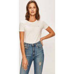 Lacoste - T-shirt. Niebieskie topy damskie Lacoste, bez wzorów, z elastanu, z okrągłym kołnierzem. W wyprzedaży za 139,90 zł.