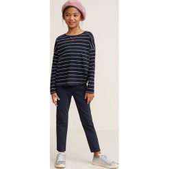 Mango Kids - Spodnie dziecięce Chin 110-164 cm. Niebieskie spodnie dziewczęce marki Mango Kids, z elastanu, casualowe. W wyprzedaży za 35,90 zł.