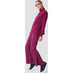 NA-KD Spodnie sportowe z haftem - Purple. Fioletowe bryczesy damskie NA-KD. W wyprzedaży za 99,37 zł.