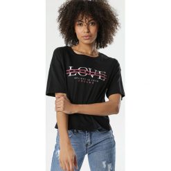 Czarny T-shirt Anthiphoia. Czarne bluzki damskie Born2be, s, bez wzorów, bez kołnierzyka, bez rękawów. W wyprzedaży za 24,99 zł.