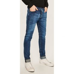 Diesel - Jeansy Tepphar-X. Niebieskie jeansy męskie Diesel, z aplikacjami. W wyprzedaży za 449,90 zł.