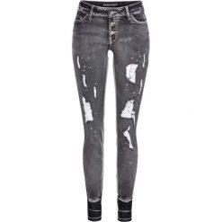 Dżinsy SKINNY "destroyed" bonprix czarny denim. Czarne jeansy damskie bonprix, bez wzorów, z jeansu. Za 69,99 zł.