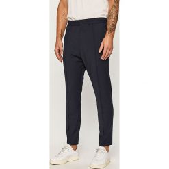 Hugo - Spodnie. Niebieskie spodnie męskie HUGO, z haftami, z elastanu. Za 599,90 zł.