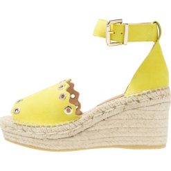 Kanna CAPRI Sandały na platformie amarillo. Żółte sandały damskie marki Kanna, z materiału, na koturnie. Za 459,00 zł.