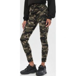 Ciemnozielone Legginsy Shirinova. Zielone legginsy damskie Born2be, s, bez wzorów. Za 49,99 zł.