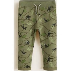 Mango Kids - Spodnie dziecięce Mateo 80-104 cm. Niebieskie spodnie chłopięce marki Mango Kids, bez wzorów, z bawełny, casualowe. Za 49,90 zł.